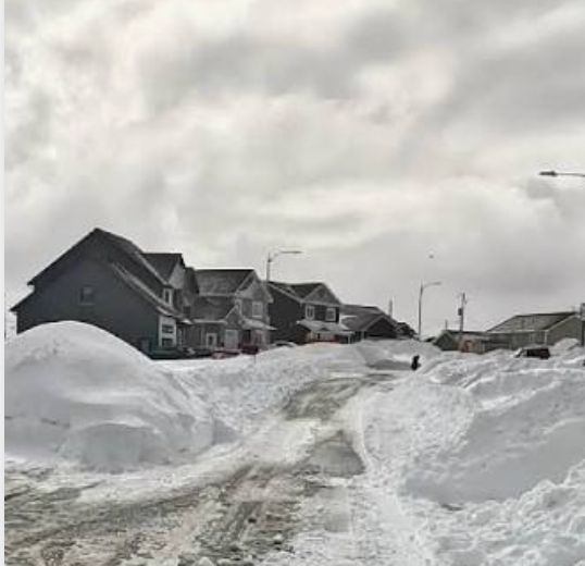 Regina Weather and Snow Removal Snow drifts around a residential property in Regina